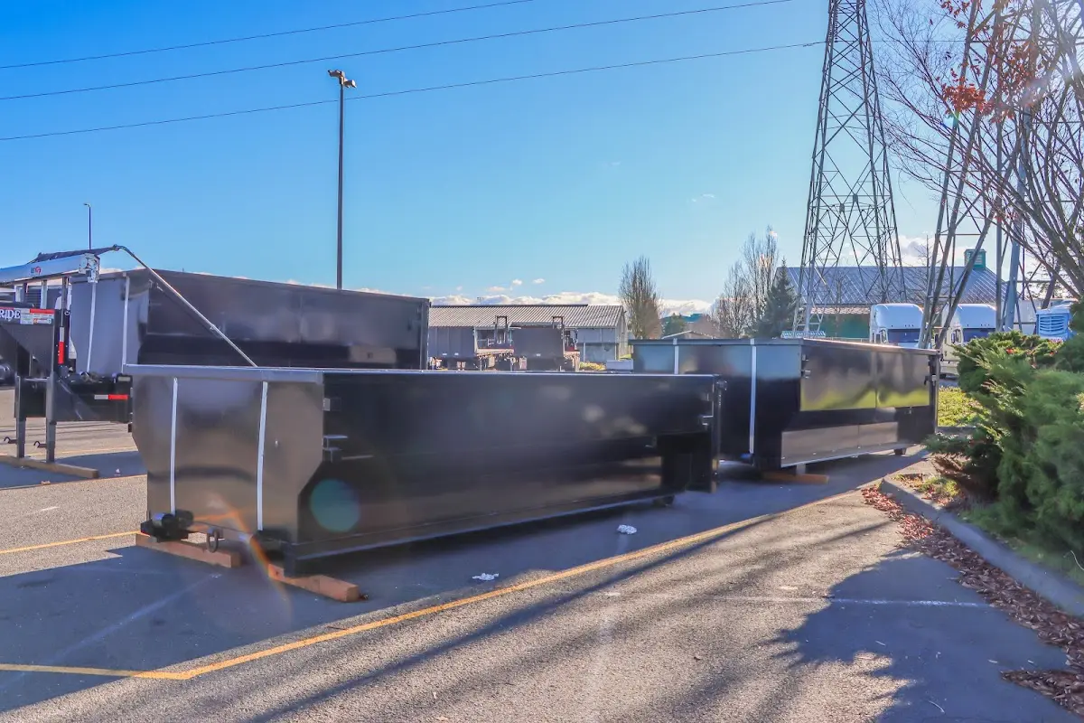 Roll-off dumpster ready for waste disposal at job site for 2 Yard Dumpster Rental in Cadillac
